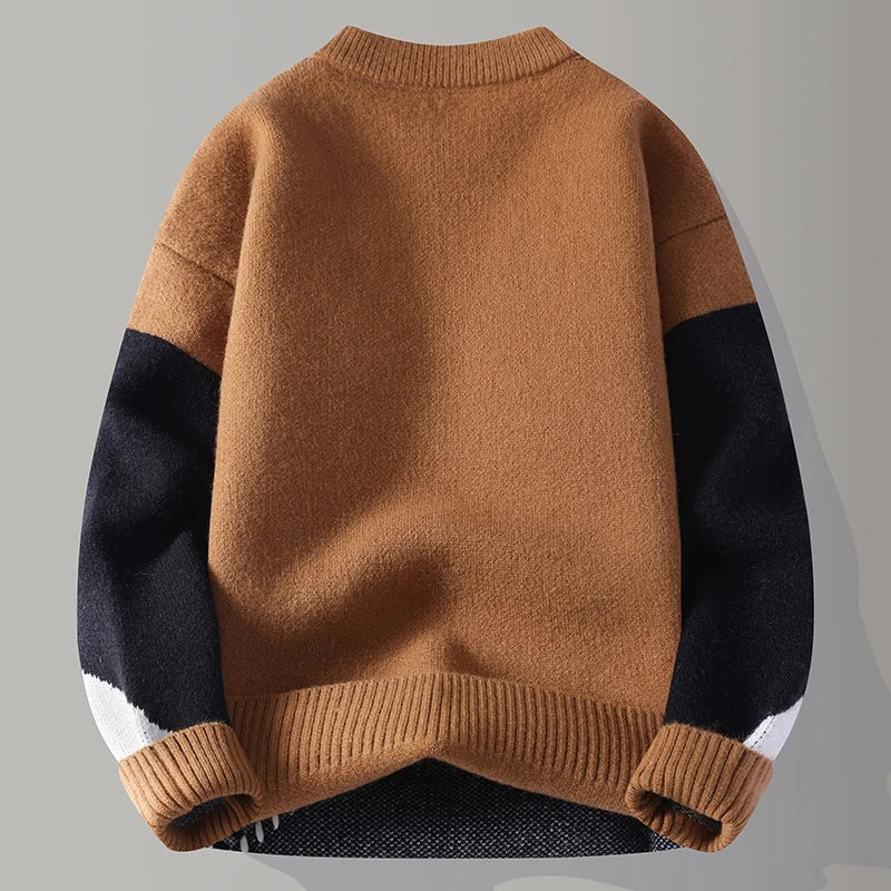 Warmer Herren-Strickpullover mit stilvollem Color-Blocking-Muster und gerippten Bündchen. Ideal für Winter.