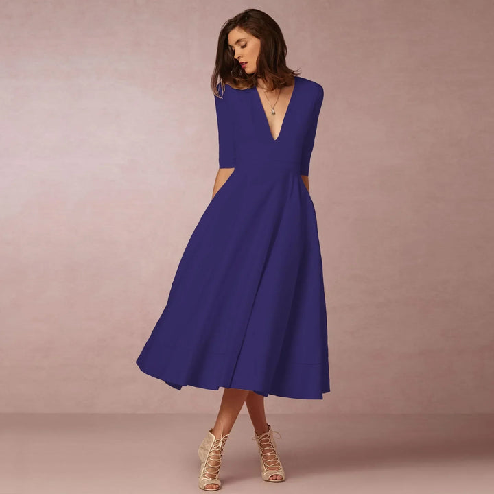 Zeitloses, fließendes Damen Sommerkleid in Midilänge, ideal für feminine Sommermode und Freizeit.