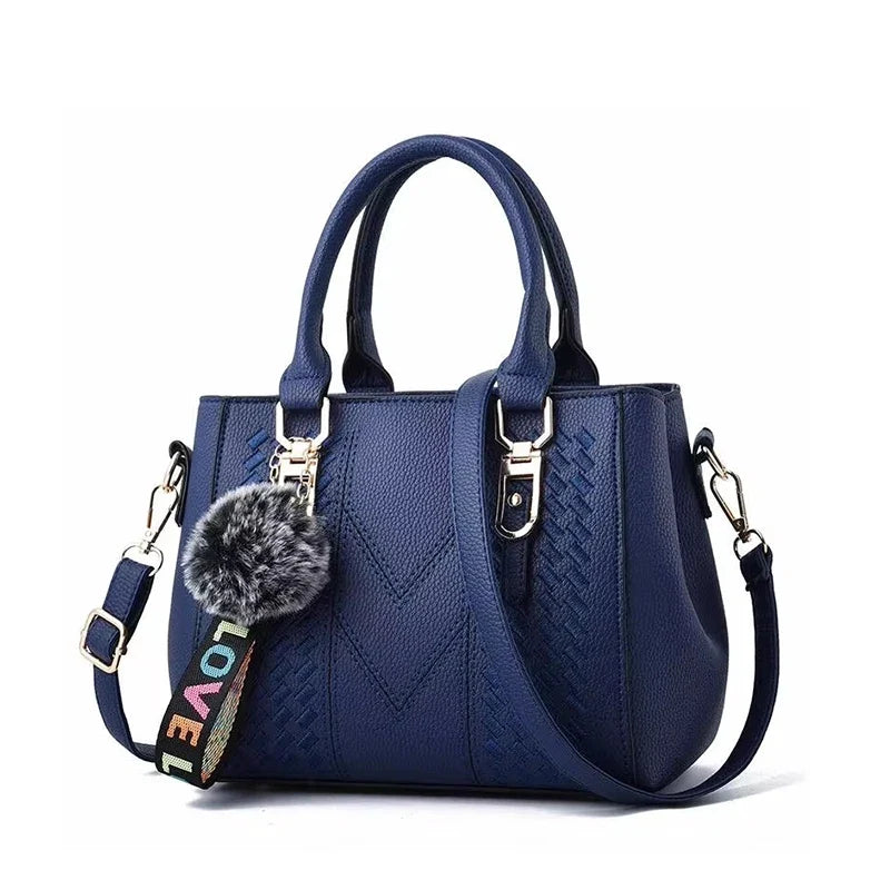 Damen Leder Umhängetasche mit eleganter Stickerei; modisch und vielseitig als Schulter- und Handtasche.