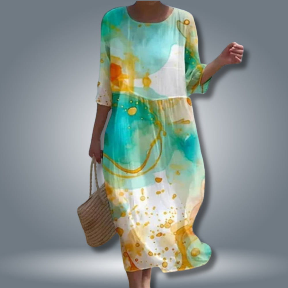 Damen Sommerkleid mit Blumendruck, Rundhals und 3/4 Arm. Ein bequemes Smokkleid für Freizeit oder festliche Anlässe.
