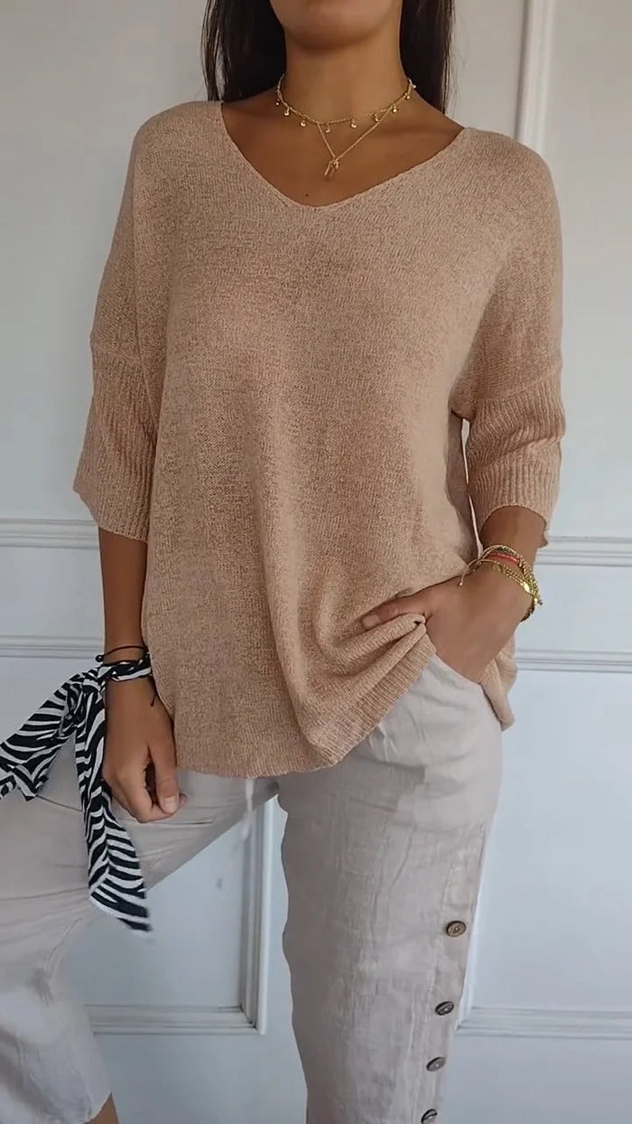 Feminines Damen Freizeit Top mit V-Ausschnitt, lockerer Passform und 3/4-Arm für unaufdringlichen Stil.