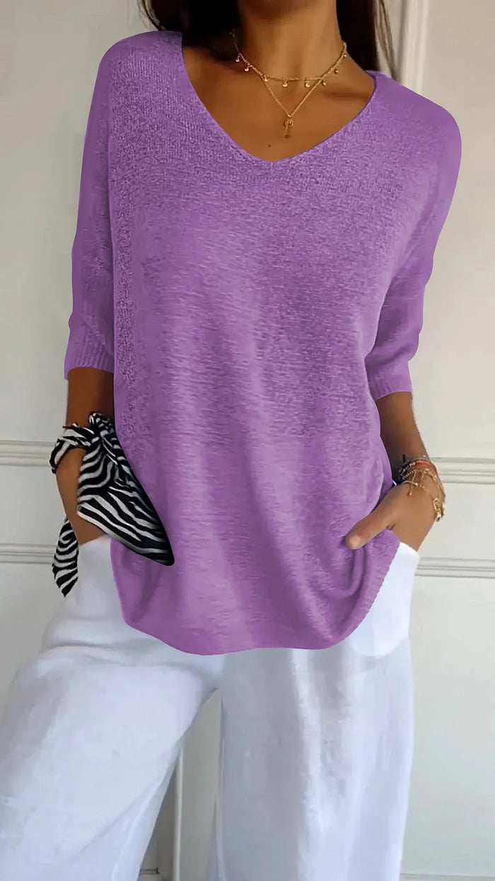Elegantes Damen Top mit V-Ausschnitt und 3/4-Ärmeln; lockere Passform für den modernen Alltagslook.