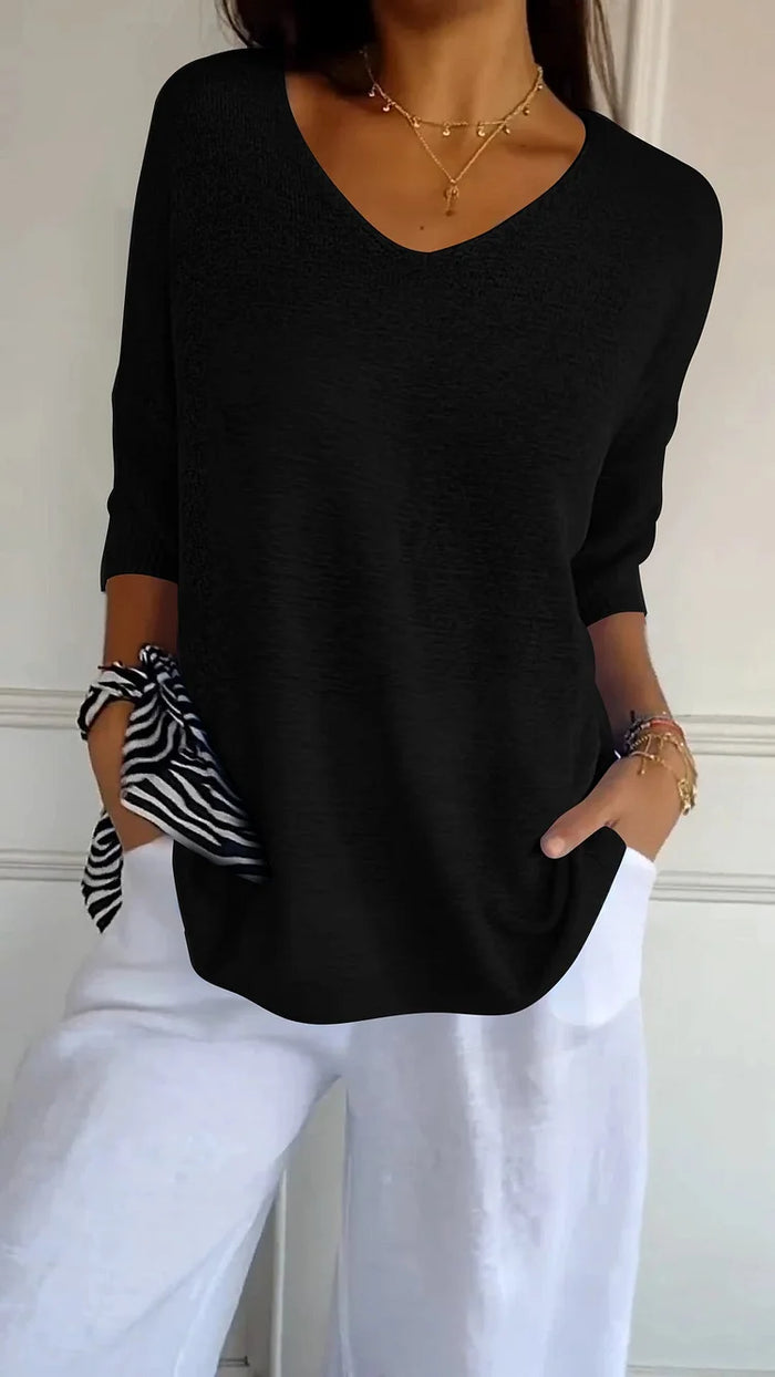 Lockeres Damen Top mit V-Ausschnitt und 3/4-Arm; ein bequemes Oberteil für Freizeit und Casual Chic.