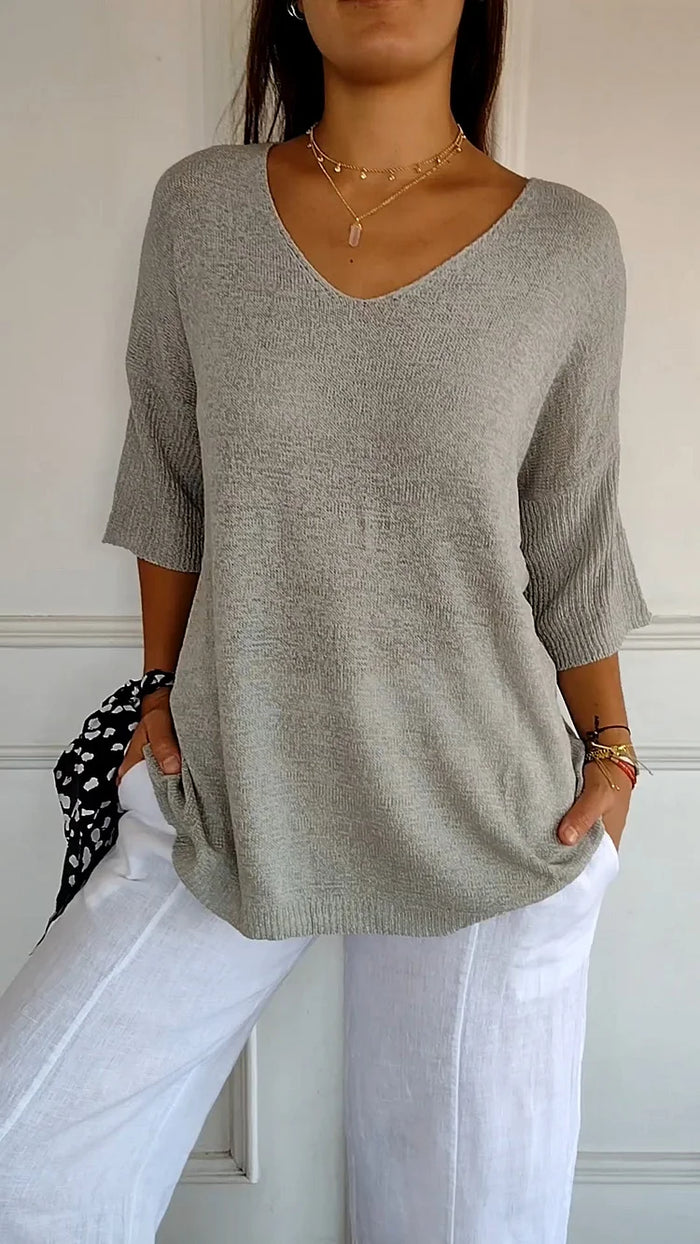 Komfortables Damen V-Ausschnitt Top mit 3/4-Arm; lockere Passform für einen unaufdringlich eleganten Stil.