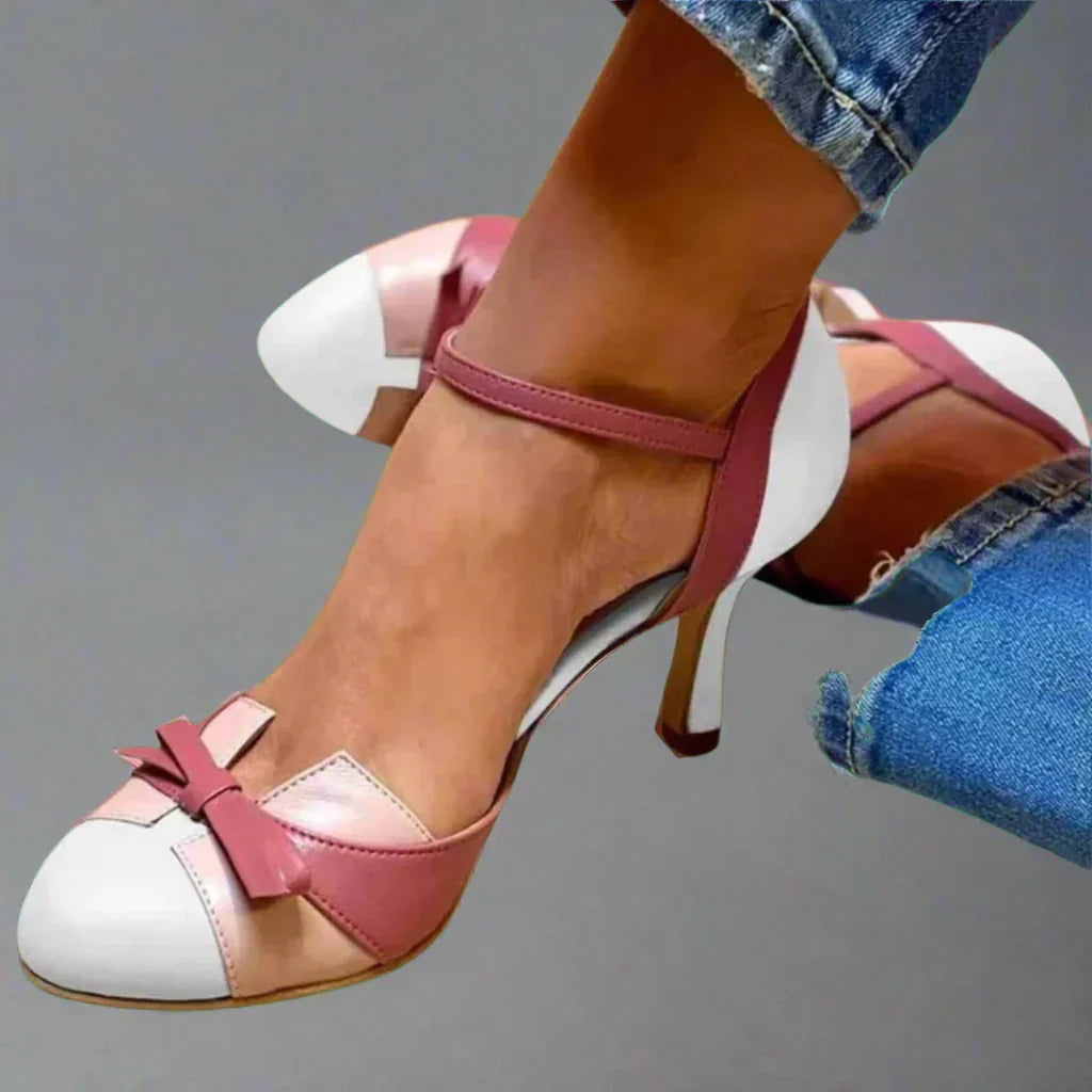 Feminine rosa Schleifenpumps mit mittelhohem Absatz. Elegante Damenschuhe für Büro, festliche Anlässe oder Freizeit.