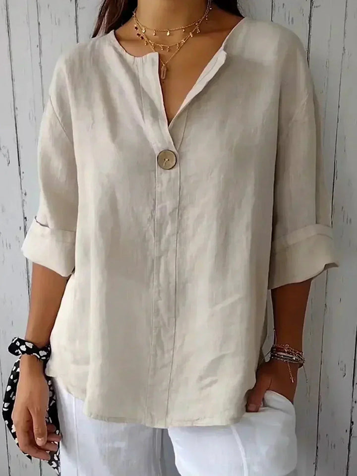Damen V-Ausschnitt Top mit 3/4 Arm. Bequemes, locker geschnittenes Freizeit-Top für den Sommer.