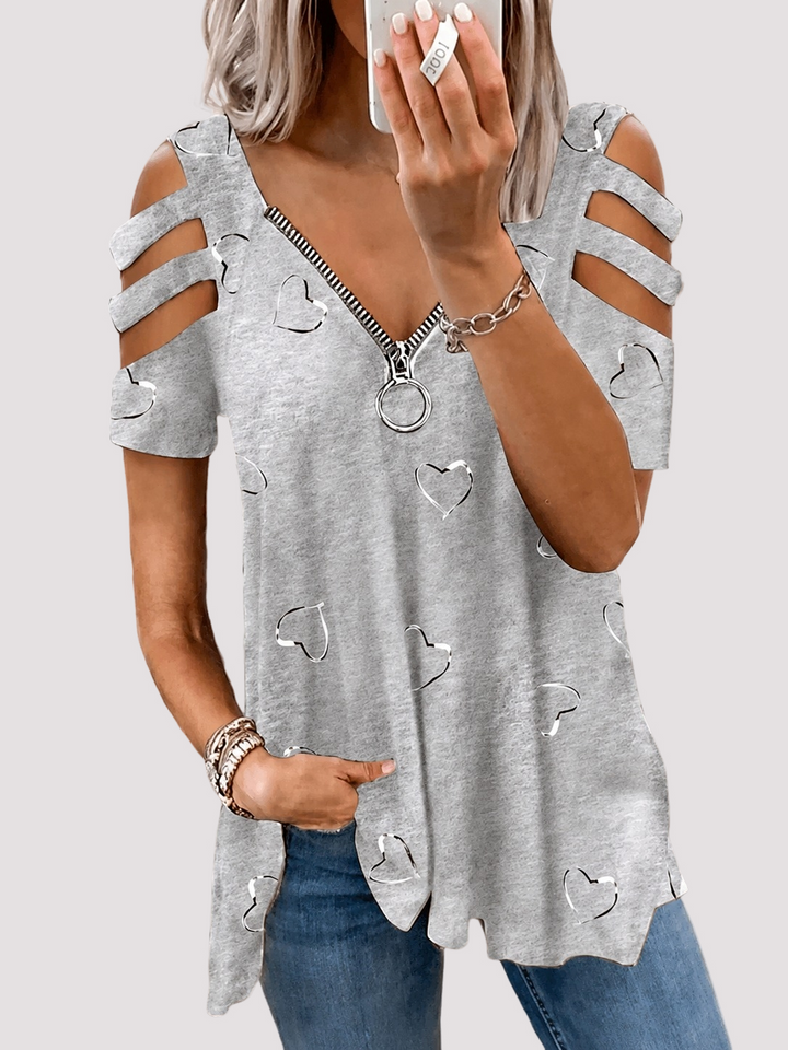 Stilvolles Damen Herzprint Top mit modernen Cut-Out-Ärmeln. Ein bequemes & modisches Sommer-Keypiece.