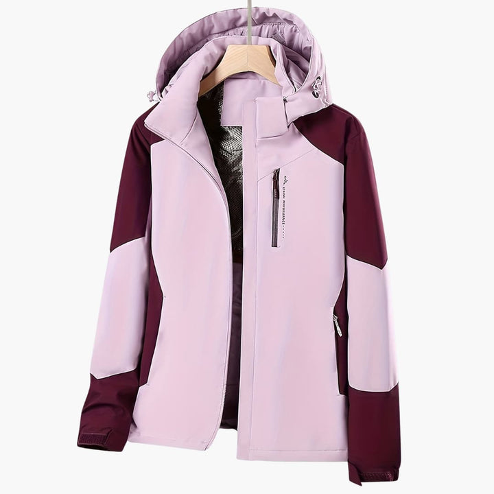 Winddichte Damen Kapuzenjacke, ideal als Übergangsjacke für Frühling & Herbst. Sportliche Outdoor-Mode mit stilvollem Farbblock.
