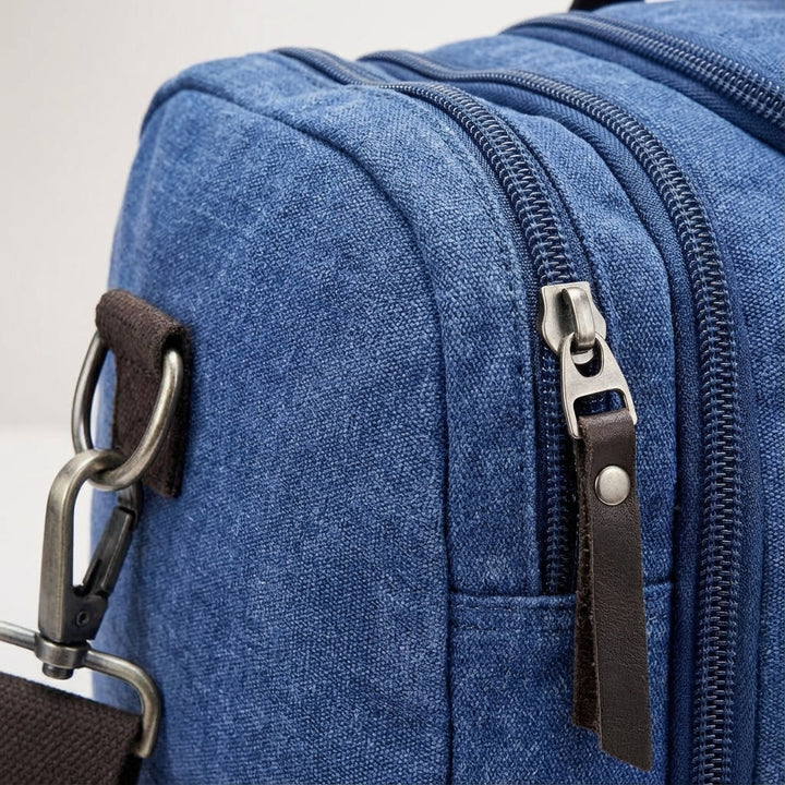 Blaue, erweiterbare Canvas-Reisetasche. Robuster Duffel & Handgepäck für Wochenenden und kurze Reisen. Unisex.