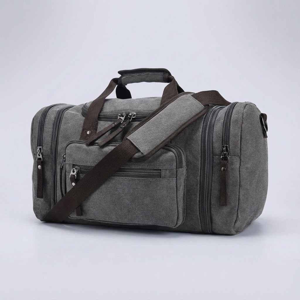 Graue, erweiterbare Canvas-Reisetasche. Praktische Wochenendtasche, Sporttasche oder Handgepäck für Ihre Reise. Unisex.