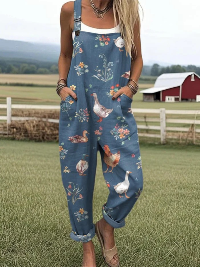 Damen Vintage Jumpsuit in Tiefseeblau mit Blumenmuster für Frühling/Sommer. Leicht, weit geschnitten & bequem für Freizeit/Urlaub.