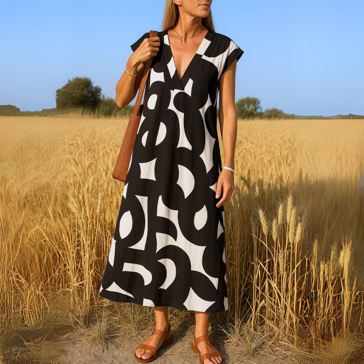 Elegantes Damen V-Ausschnitt Maxikleid mit einzigartigem grafischen Muster und schmeichelhafter A-Linie. Perfekt für Frühling.
