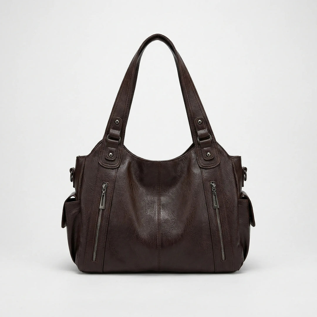 Nikita Crossover Tasche in klassischem Schwarz, vielseitig als Schultertasche und Damentasche.