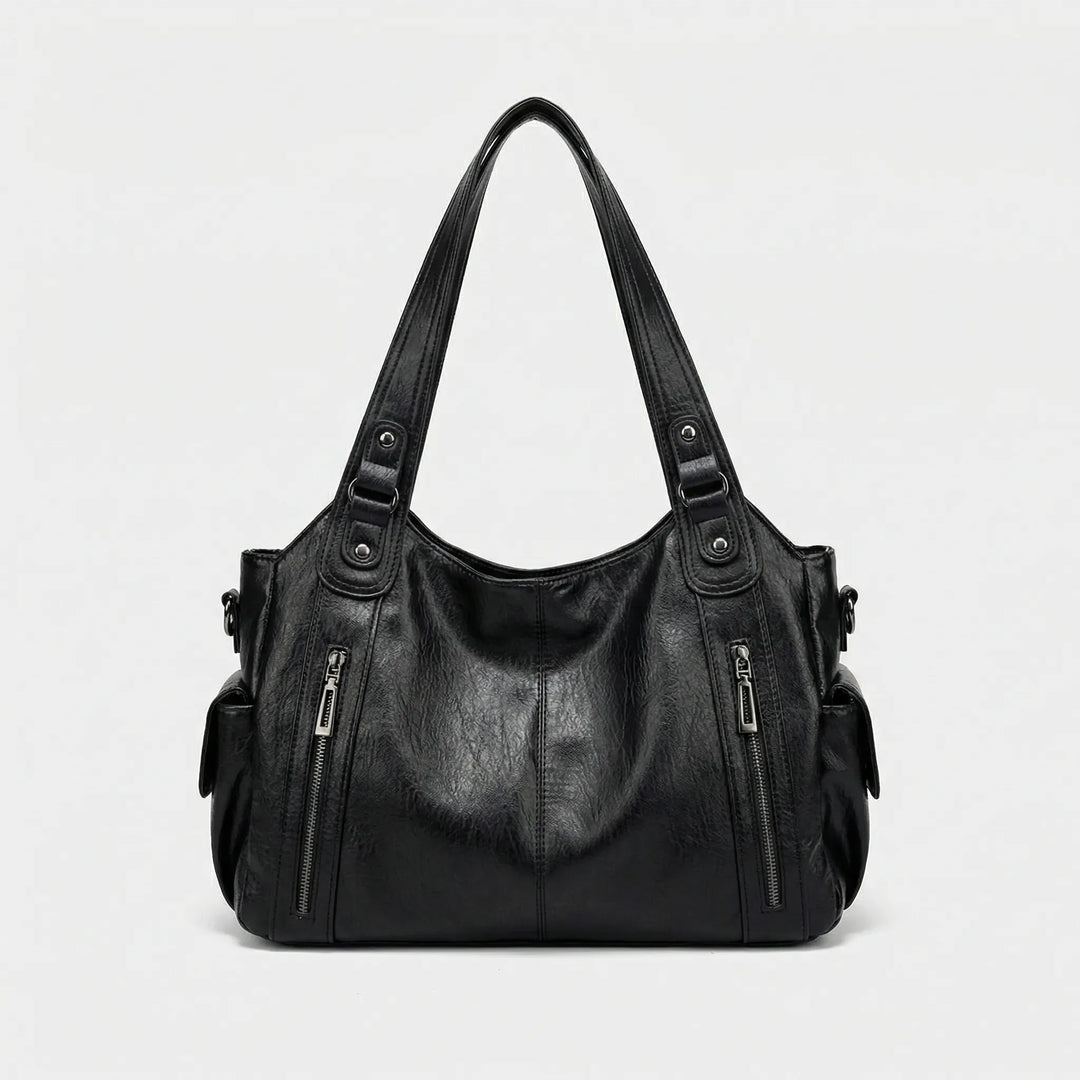 Flexible Nikita Crossover Tasche in Braun, bequem als Umhängetasche tragbar, ideal für Damen.