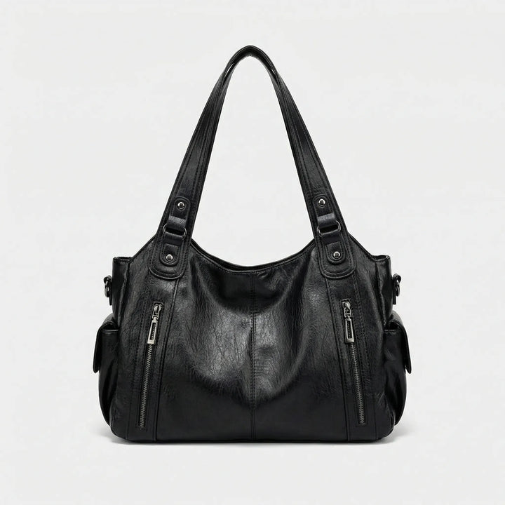 Flexible Nikita Crossover Tasche in Braun, bequem als Umhängetasche tragbar, ideal für Damen.