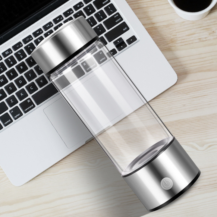Schicke HydroPro Wasserstoff-Flasche mit USB-Ladefunktion. Transparentes Borosilikatglas, unisex.