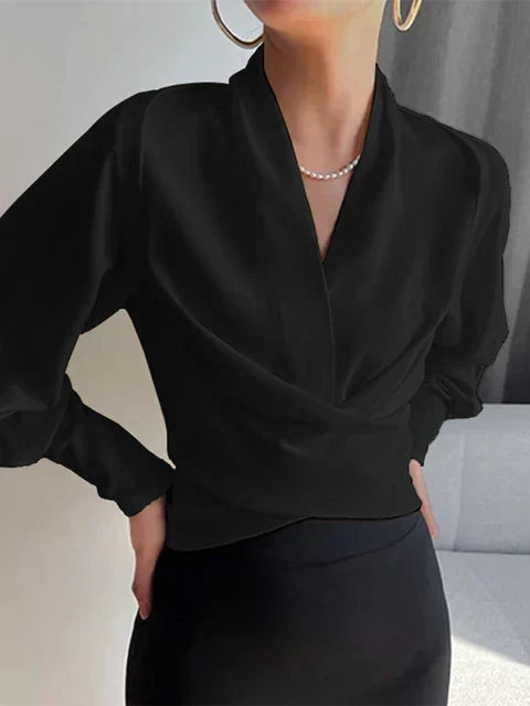 Trendige Damenbluse mit V-Ausschnitt und Puffärmeln. Vielseitiges Oberteil, ideal für Büro und Freizeit.