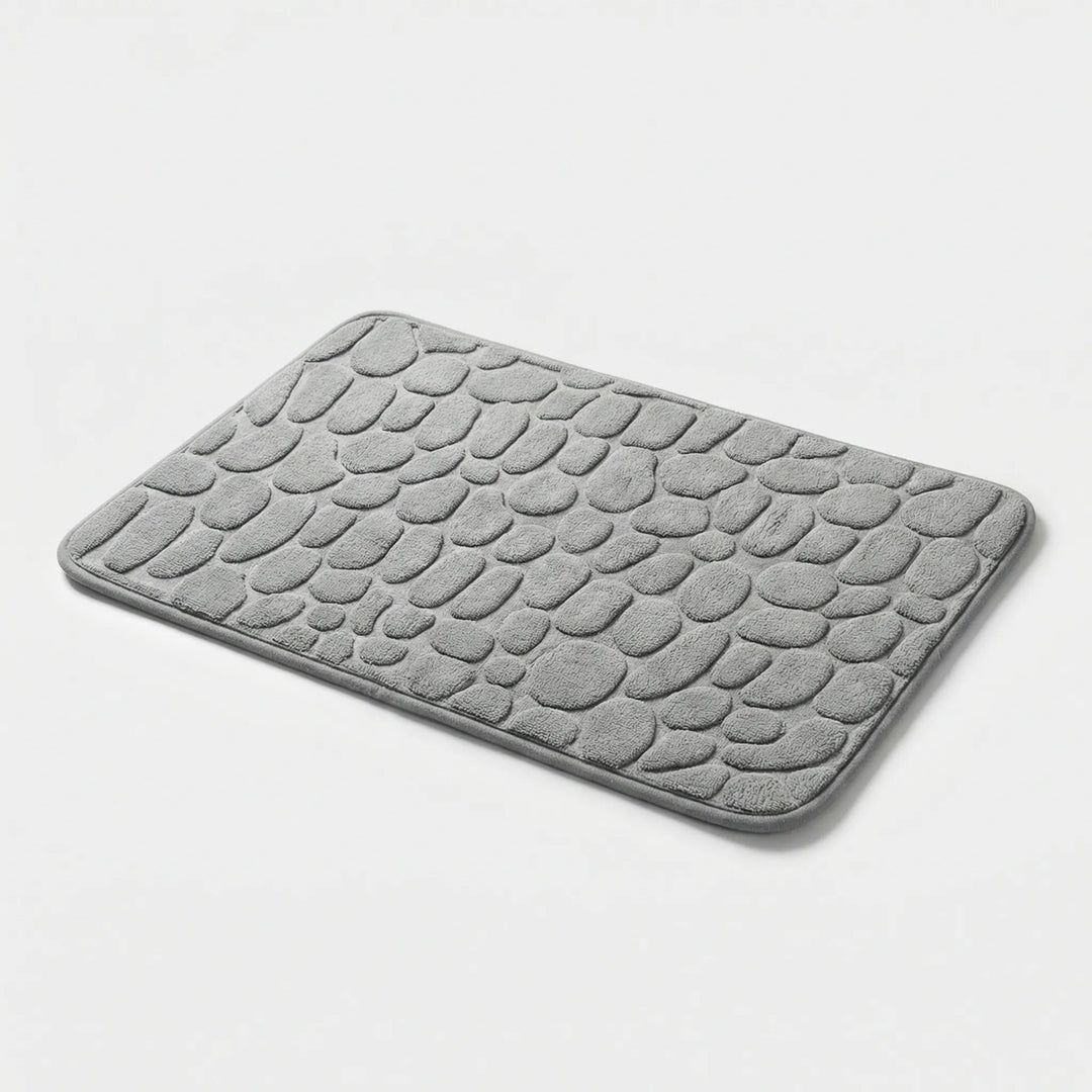 Rutschfeste Badematte Drystone mit elegantem Kieselmuster, ideal für Sicherheit & Stil im Bad.