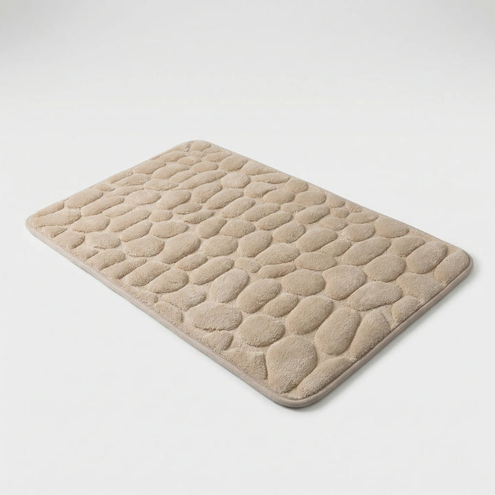 Duschmatte Drystone mit strukturierter Oberfläche im Kieseldesign & rutschfester Unterseite für Sicherheit.
