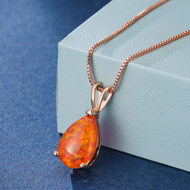Damen Schmuck: Zierliche Tropfen-Halskette mit schimmerndem Opal, elegantes Design.