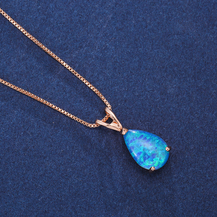 Edelstein-Halskette Damen: Tropfen-Anhänger mit schillerndem Opal, in Roségold gefasst.