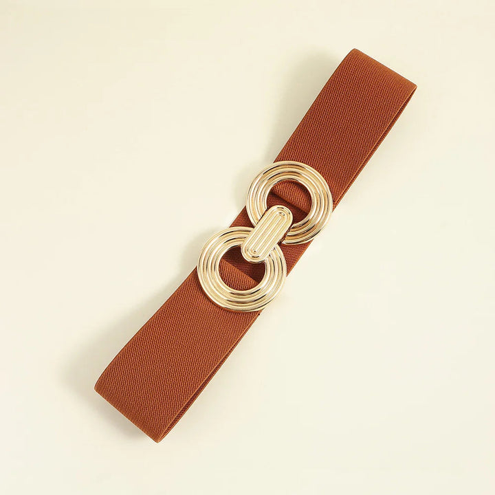Eleganter elastischer Taillengürtel für Damen. Stylisher Gürtel mit markanter runder Schnalle.