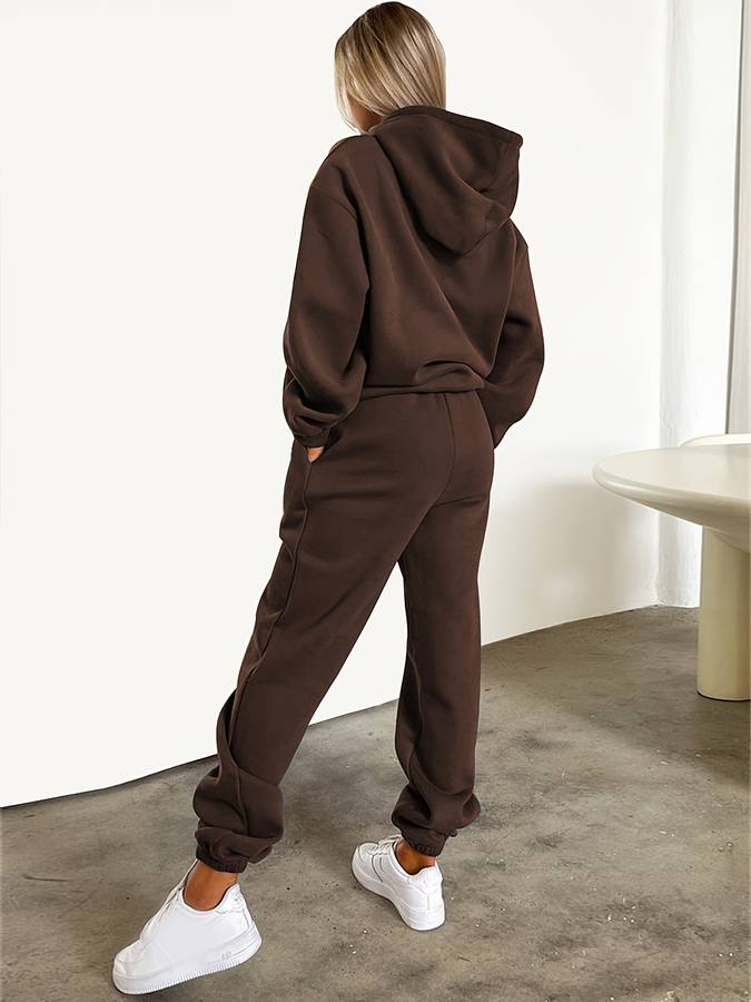Zweiteiliges Damen Jogginganzug Set: Moderner Kapuzenpullover & passende Hose für Sport & Freizeit.
