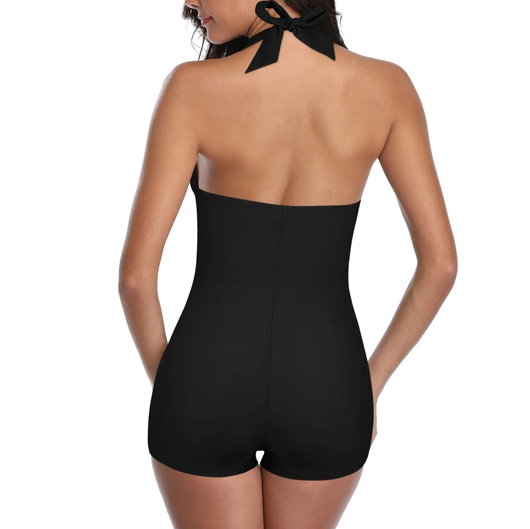 Grüner, femininer Damen-Badeanzug, rückenfrei, gepolstert. Die perfekte Schwimmmode für einen eleganten Strandlook.