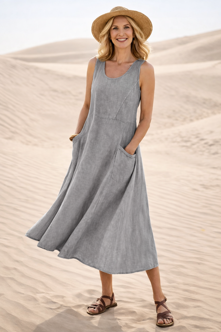 Bequemes A-Linien Damen Midikleid mit lockerem Schnitt und praktischen Taschen. Ein Muss als Freizeit- & Reisekleid.