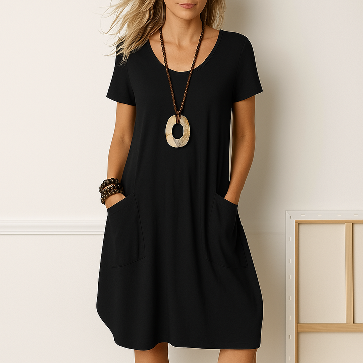 Bequemes Damen Kurzarm Sommer Midikleid mit lockerer Passform und nützlichen Taschen. Ideal als Strand- oder Freizeitkleid.