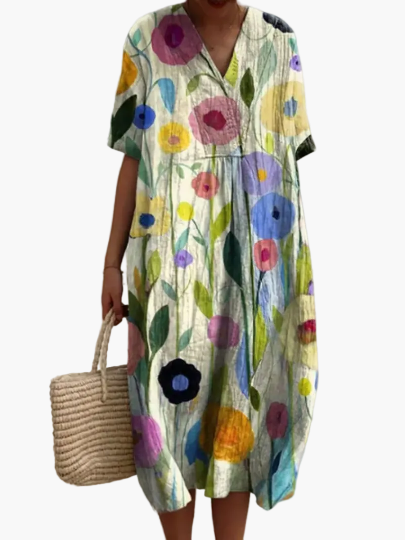 Luftiges Damen Midikleid mit Blumenprint, locker geschnitten, für Strand & Stadt im Sommer.