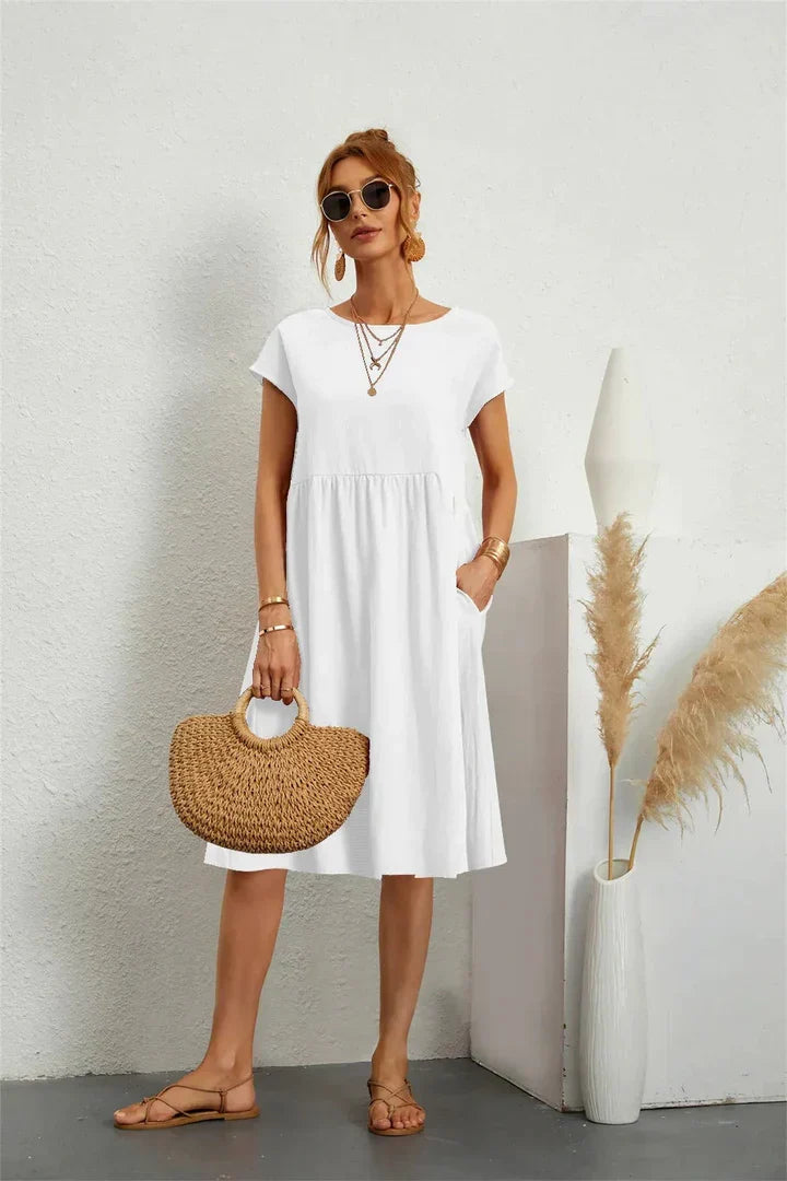 Blaues Damen Sommerkleid in A-Linie, Kurzarm, Rundhals & Taschen für einen lässigen und modischen Look.