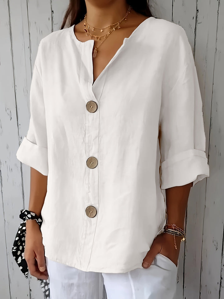 Moderne Damen Bluse mit Knopfleiste, 3/4-Ärmeln, perfekt für einen eleganten oder lässigen Look.