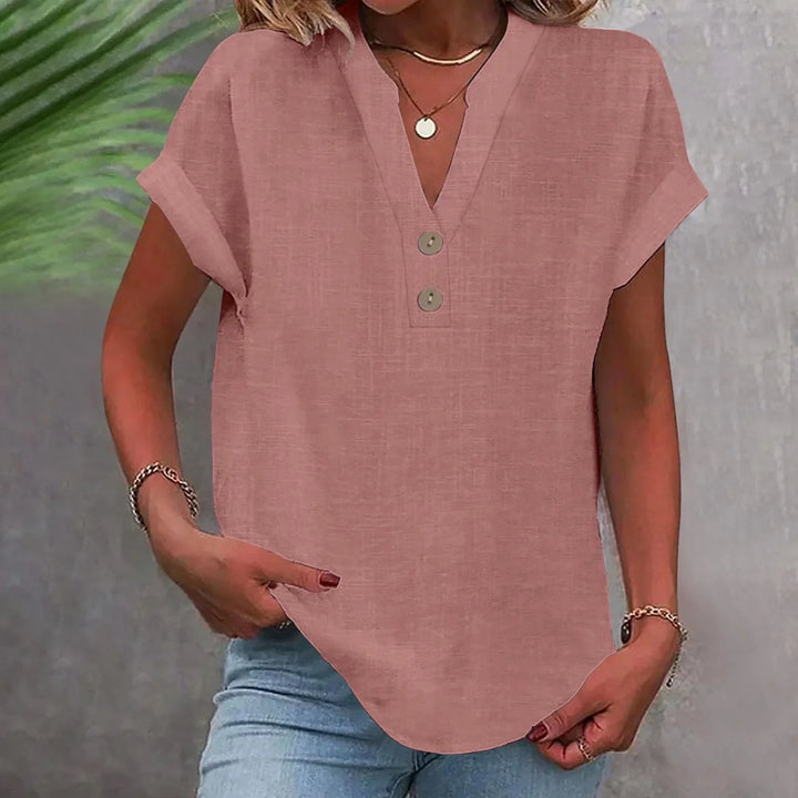 Elegante Damenbluse mit V-Ausschnitt, Knöpfen und fließendem Material. Ideal für festliche Anlässe.