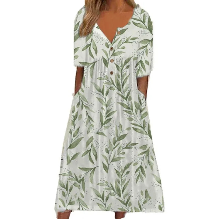 Nahaufnahme: Modisches Kurzarmkleid mit lebhaftem Blumendruck und tiefem V-Ausschnitt.