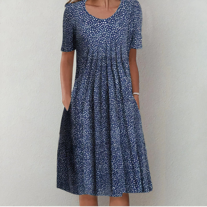 Sommerliches Damen Midikleid mit Blumenmuster, fließend. Perfekt für Hochzeiten, festliche Anlässe und Urlaub.