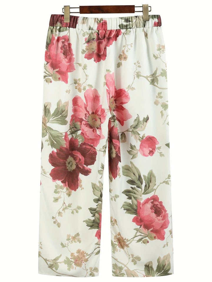 Vielseitige Damenhose mit weitem Bein, blumigem Muster & elastischem Bund. Stilvolle Komfort-Hose für alle Jahreszeiten.