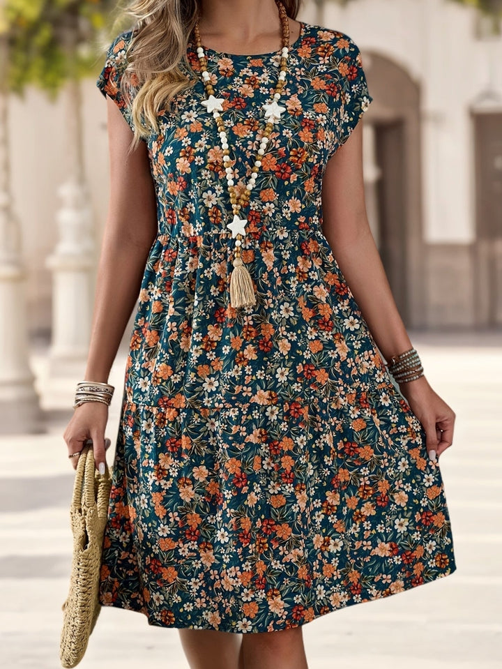 Damen Sommerkleid mit floralem Blumenmuster, knielang, Kurzarm. Ideal als Freizeitkleid oder Urlaubskleid.