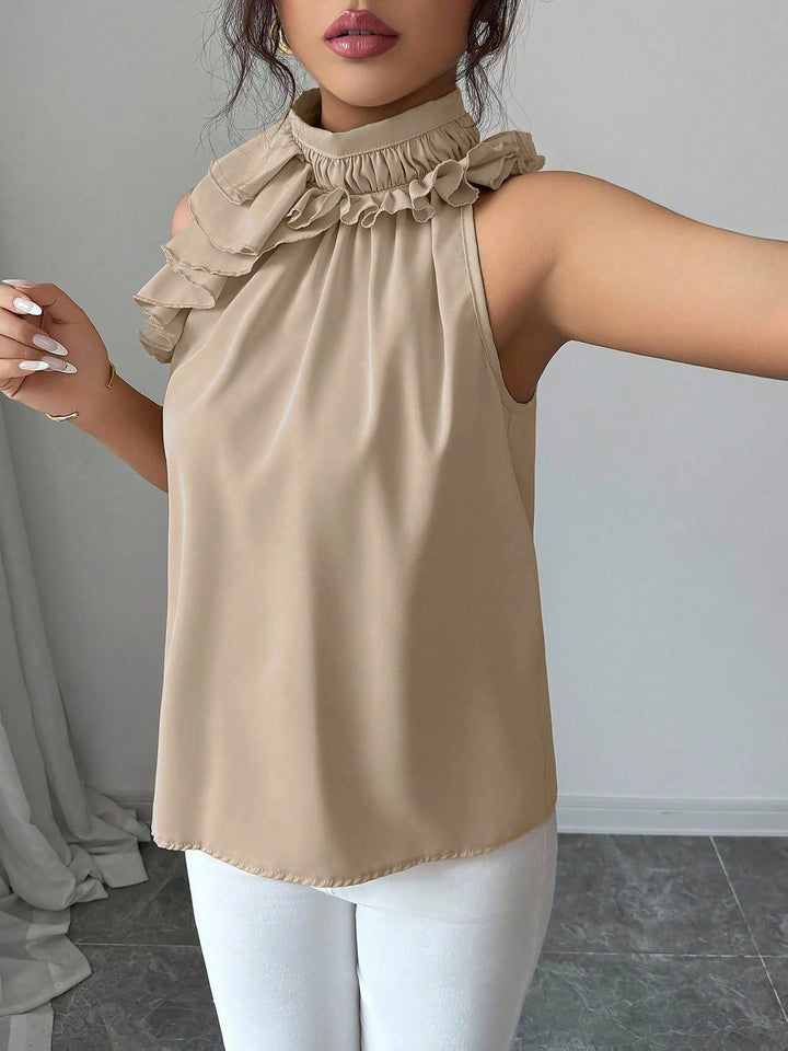 Modische Damen Rüschenbluse ärmellos, mit chicem Stehkragen, ideal für Business- & Abend-Outfits.