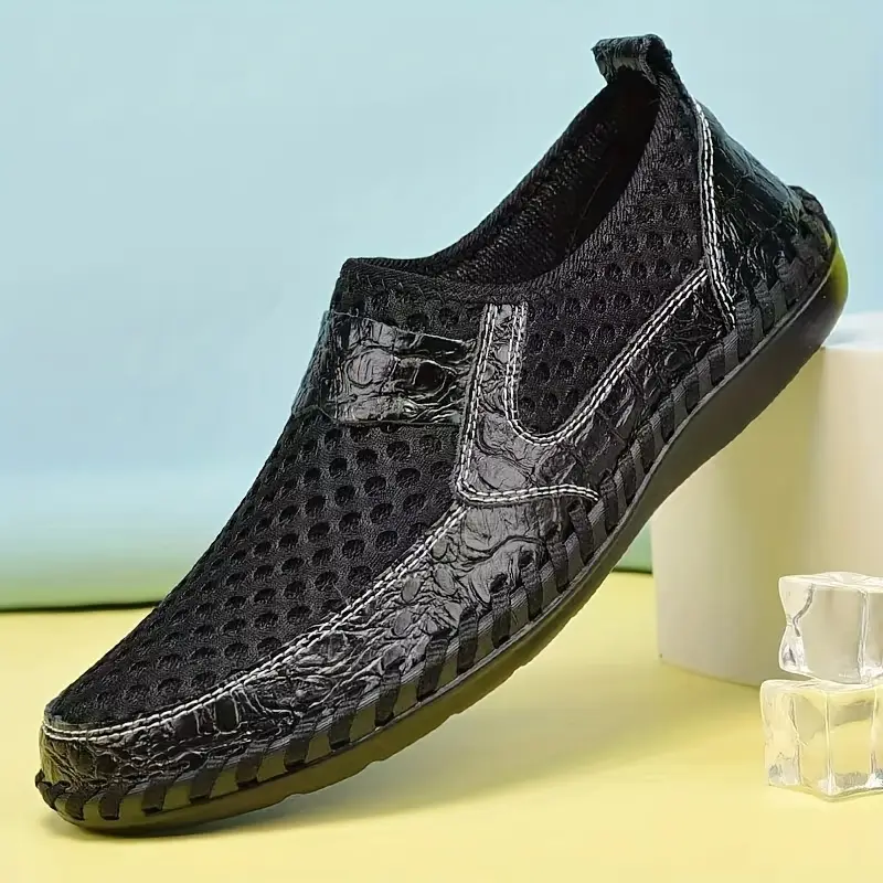 Alltagsschuhe für Herren: Dunkle Slip-on Loafers mit weicher Polsterung und breiter Passform.