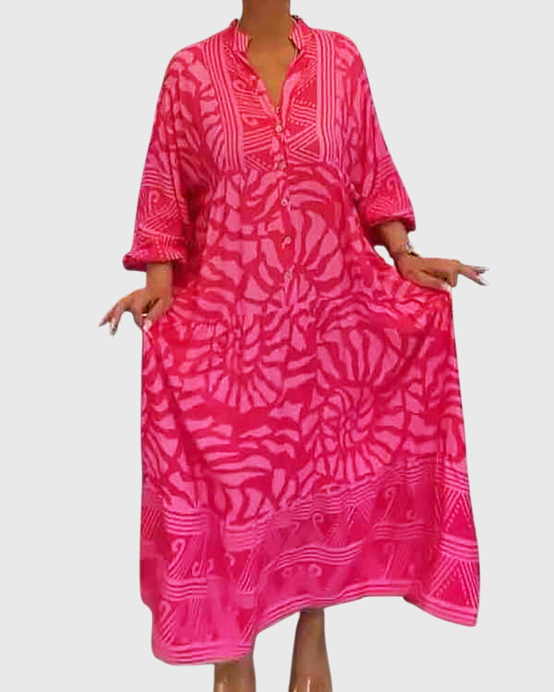 Luftiges Sommerkleid für Damen mit elegantem V-Ausschnitt, auffälligem Print und kurzen Ärmeln, locker geschnitten.