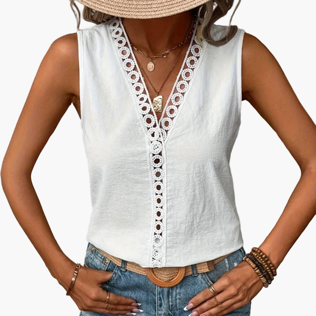 Modernes Damen Top mit Spitzendetails am V-Ausschnitt. Ärmellos und bequem, perfekt für heiße Sommertage.