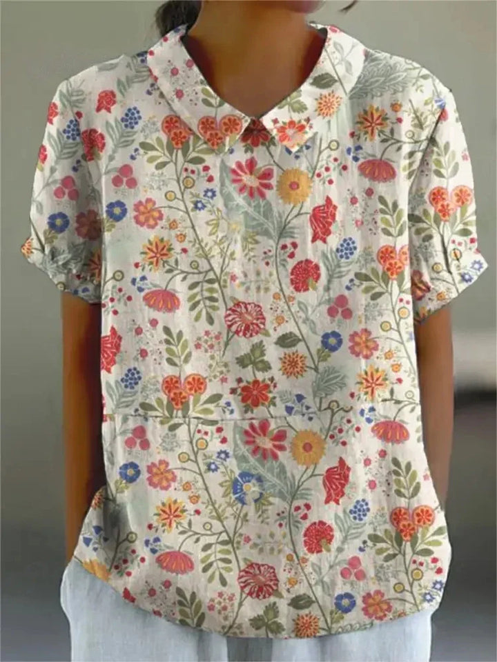 Feminine Damenbluse mit Langarm und farbenfrohem Blumendruck, vielseitig tragbar.