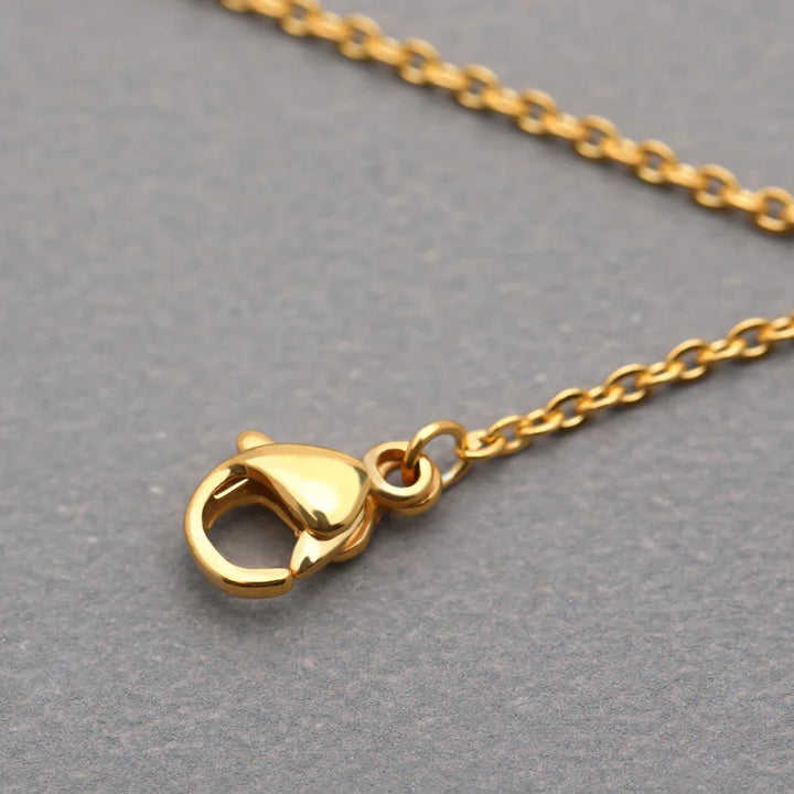 Damen Medaillon-Halskette mit detailreicher Sonnenblume. Stilvoller Schmuck aus Gold oder Silber Edelstahl.