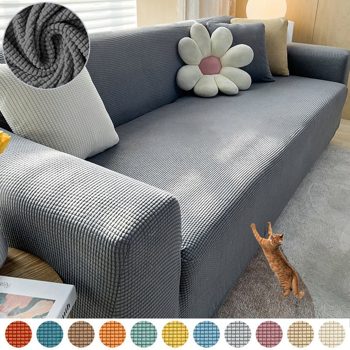 Atmungsaktive Stretch-Sofahusse in Ozeanblau. Angenehme Haptik, schützt & verschönert Ihr Sofa.