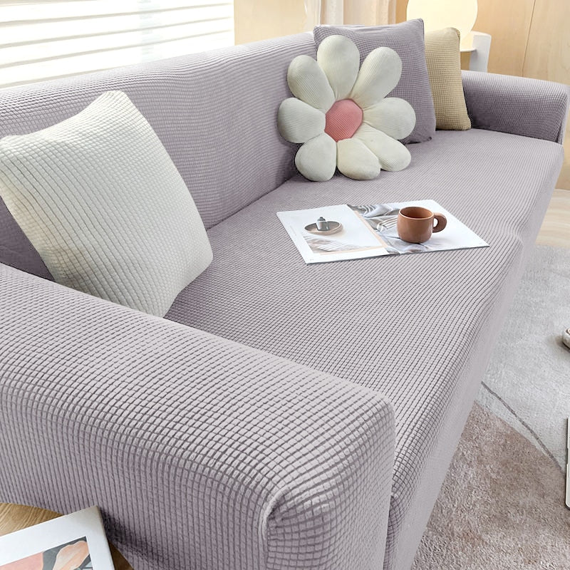 Perfekt sitzende Stretch-Sofahusse in Rot. Einfach anzubringen, bietet langanhaltenden Möbelschutz.