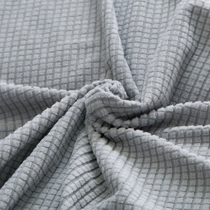 Funktionale Sofahusse in Denim-Blau. Dehnbarer Couchbezug, schützt vor täglicher Abnutzung.