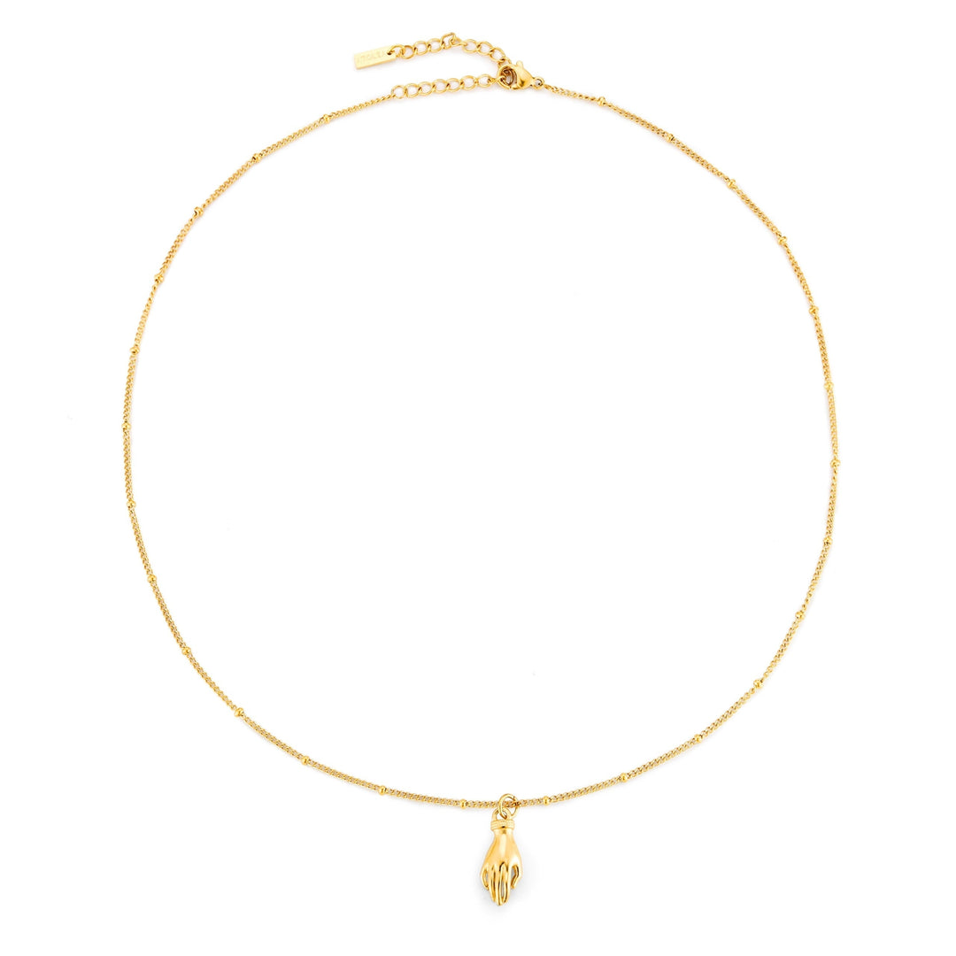Glänzende Damenhalskette goldfarben mit Schutz Hand Anhänger und grünem Zirkon. Symbolischer Edelstahlschmuck.