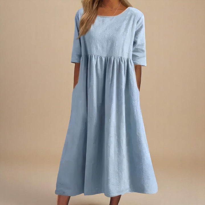 Lässiges Damen Relaxed Fit Sommer Midikleid mit Rundhals & praktischen Taschen; bequemes Freizeitkleid für warme Tage.