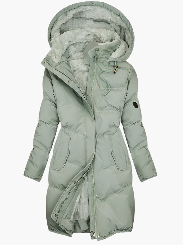 Eleganter Damen Wintermantel, langer Schnitt, mit warmer Kapuze und luxuriösem Kunstpelz. Perfekt für stilvolle Wintermode.